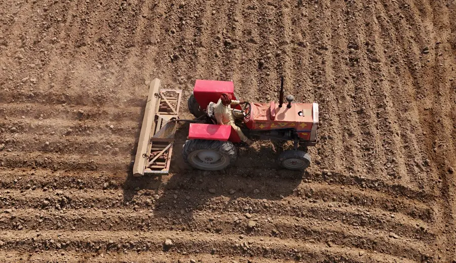 Aerial view of a tractor preparing a field in Punjab